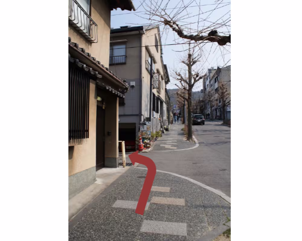 The first turning on the left off the slope
