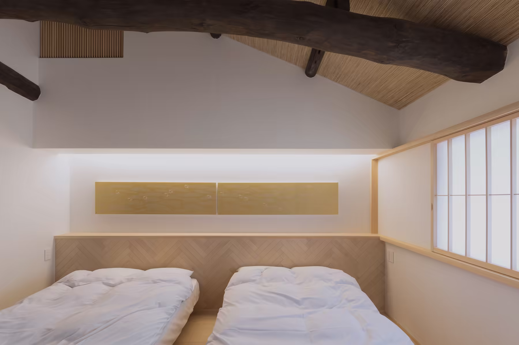 A bedroom made up with twin beds beneath the curved original ridge beam, lit by a shoji-screened window