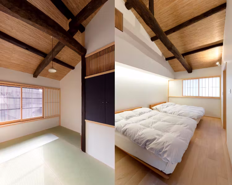 The bedroom under the timber roof, the bed made up beneath a shoji-screened window