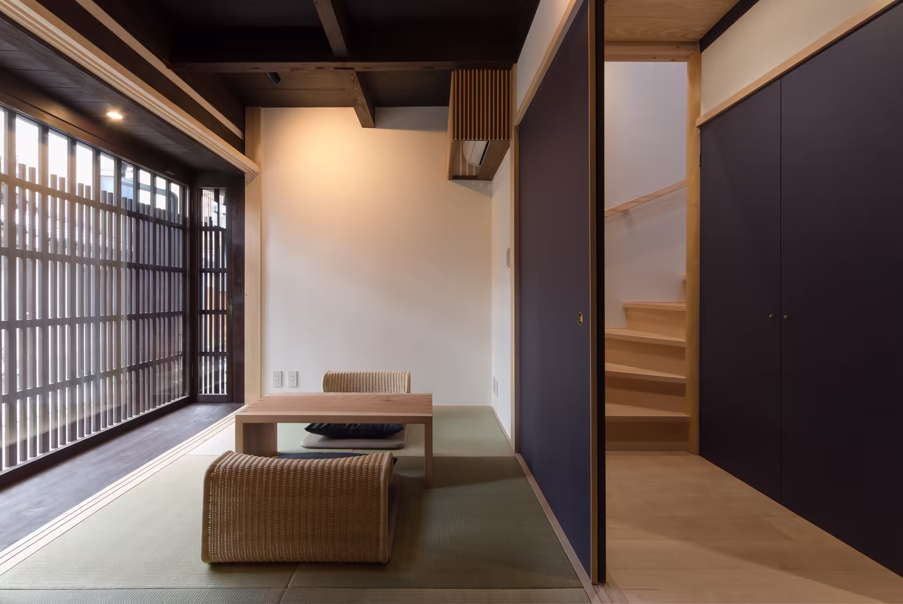 The front tatami room of BenTen West, looking out through the full-height wooden lattice onto the lane